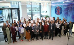 HSL and TDL team members holding their accreditation certificates