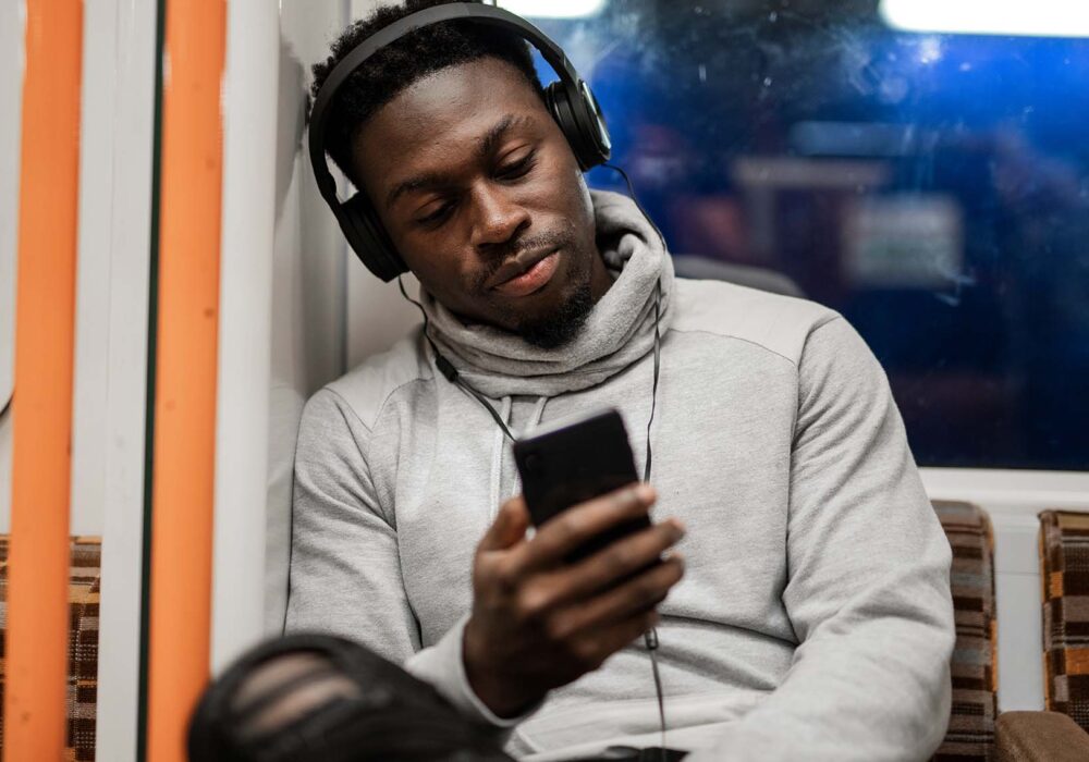 Man on train with headphones